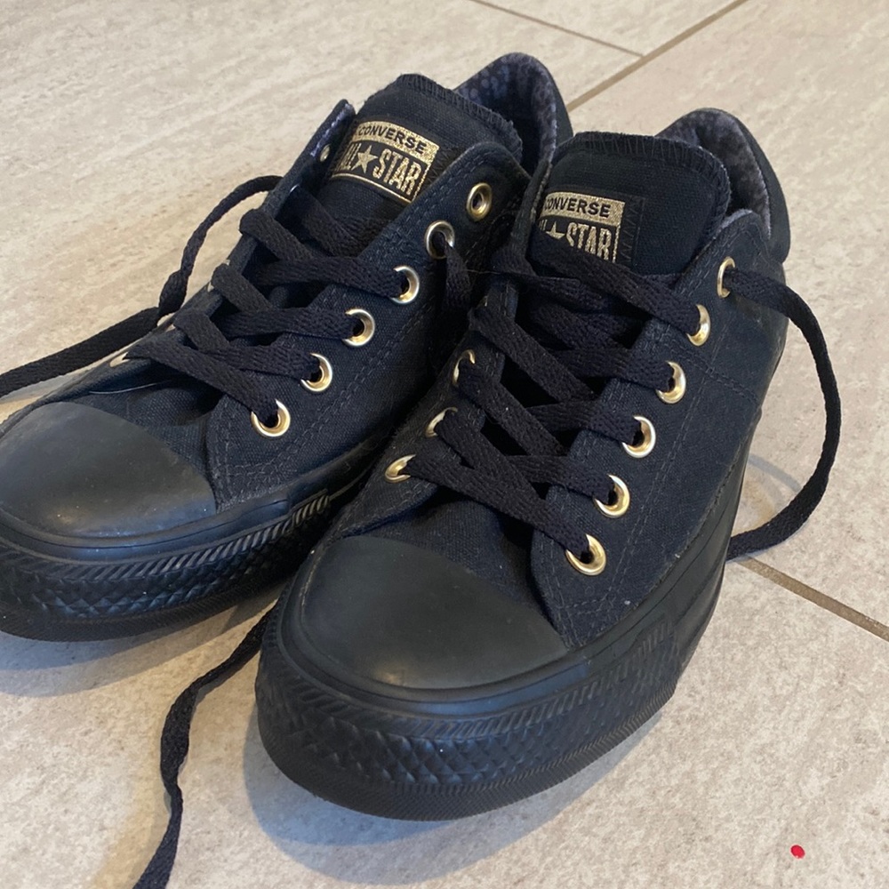 Black converse gold detail.